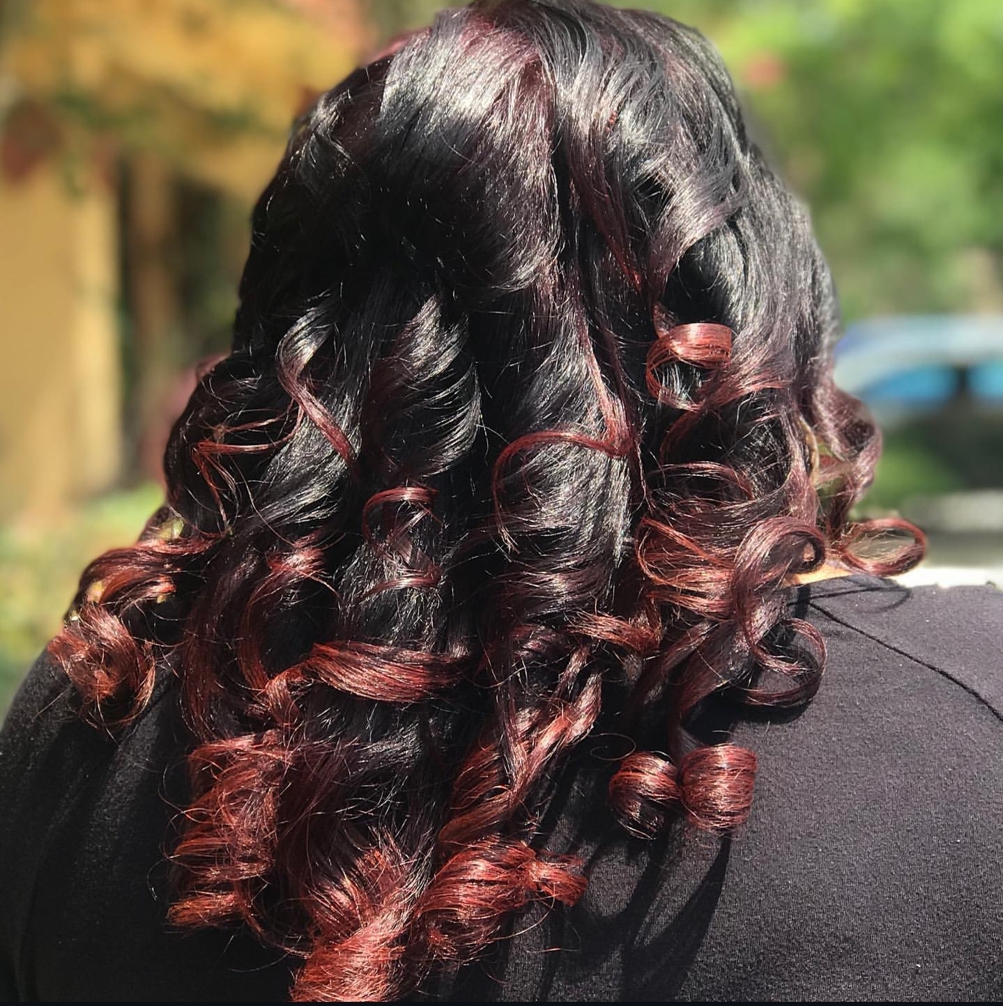 Deep burgundy dimensional color with defined curls