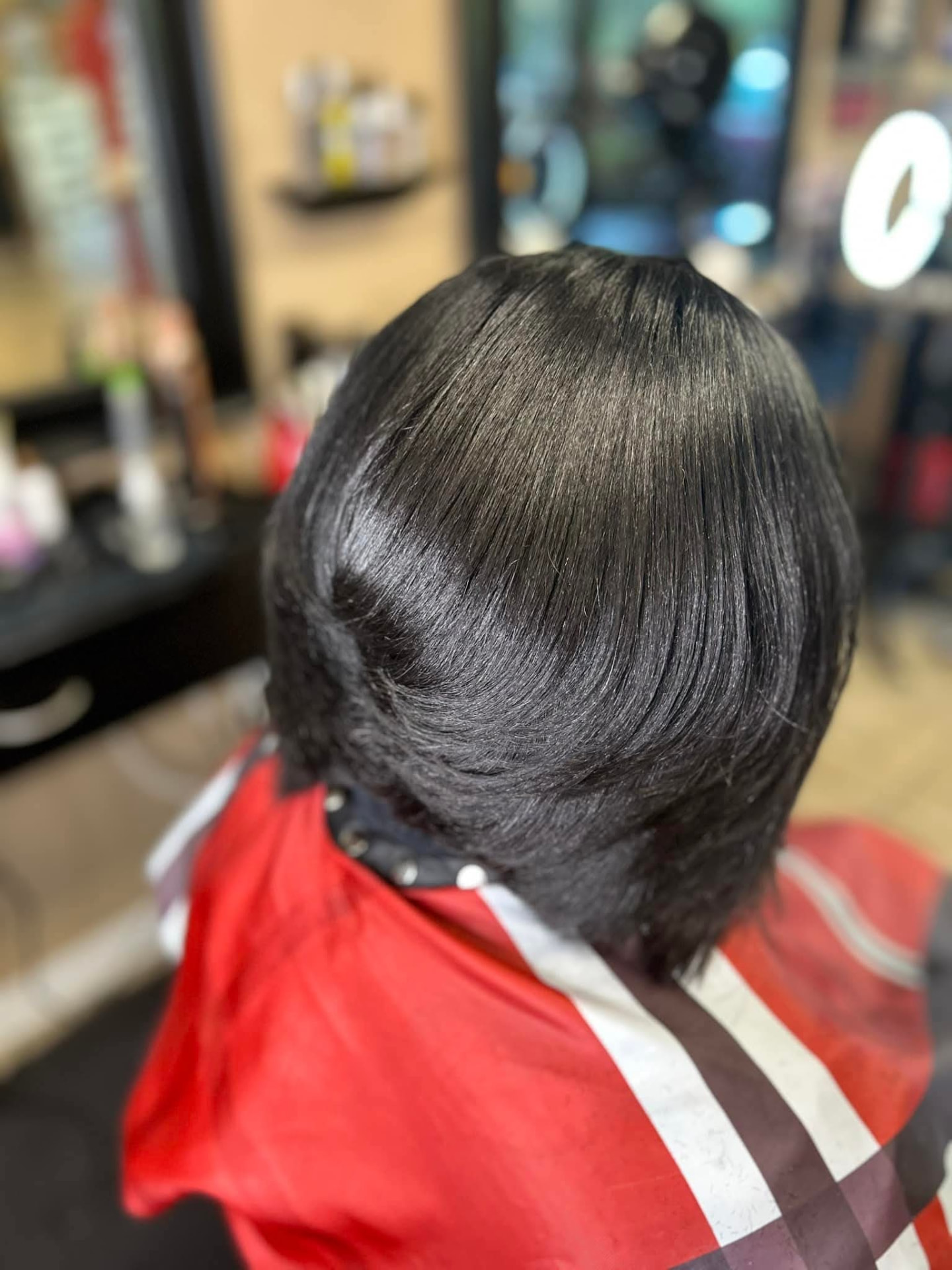 Sleek blunt bob with a smooth silk press finish