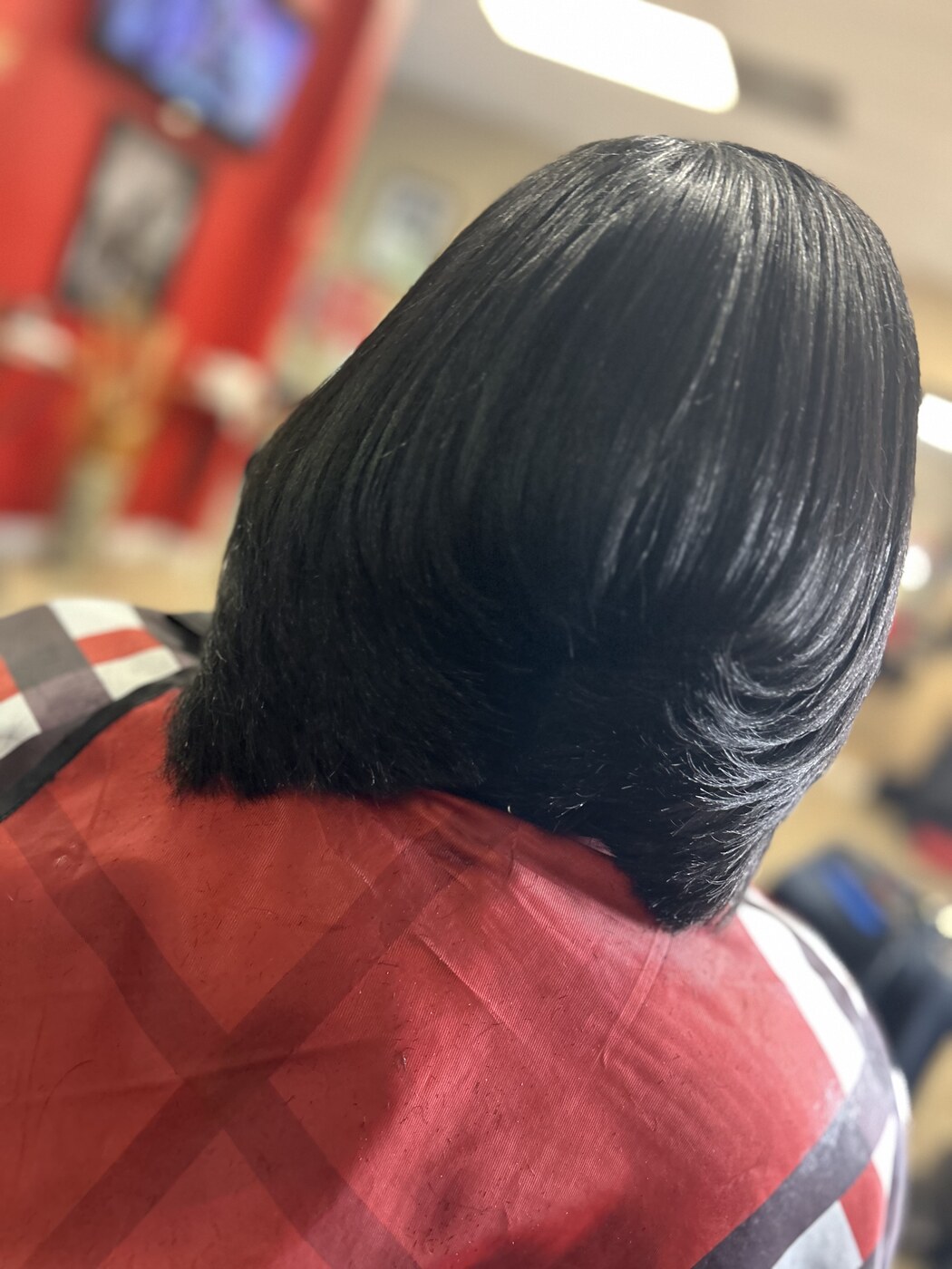 Layered silk press bob finished glossy and smooth